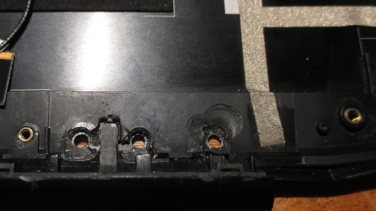 Lenovo Y50 screen lid with three drilled holes for hinge fastening